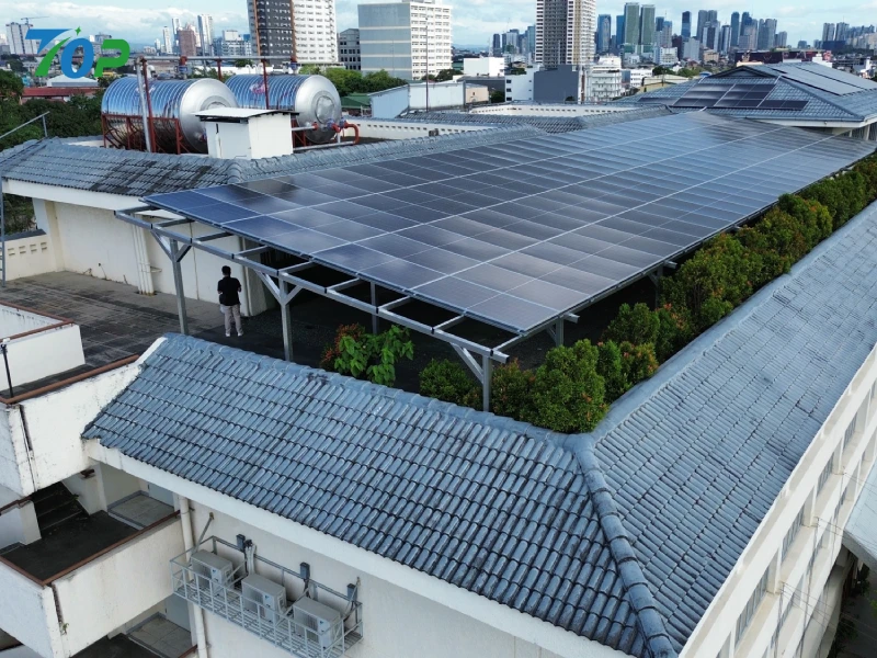 Heavy-duty elevated solar panel platform structure built over commercial roof utilities in the Philippines.